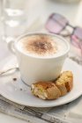Cup of Cappuccino with cantuccini — Stock Photo