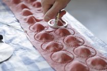 Red ravioli being made — Stock Photo