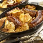 Swiss sausages with apples — Stock Photo