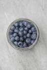 Fresh blueberries in jar — Stock Photo