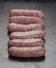 Raw delicious sausages — Stock Photo
