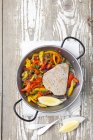 Tuna steak with braised peppers — Stock Photo