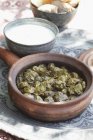 Dolmades in brown bowl over table — Stock Photo