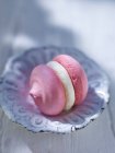 Pink meringue filled with cream filling — Stock Photo