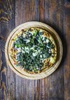 Pizza with spinach and goat cheese — Stock Photo