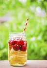 Fruity iced tea in screw-top jar — Stock Photo