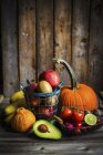 Fruit and vegetables on a wooden surface — Stock Photo