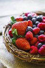 Summer berries in wicker basket — Stock Photo