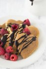 Heart-shaped pancakes with chocolate — Stock Photo