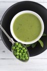 Pea soup with mint in bowl — Stock Photo