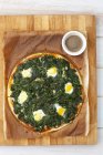 Pizza fiorentina with spinach — Stock Photo