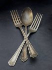 Closeup view of old silver forks and a spoon — Stock Photo