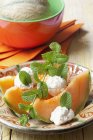 Cantaloupe melon with cheese — Stock Photo