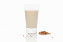 Glass of buckwheat milk — Stock Photo
