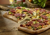 Pepper and salami pizza — Stock Photo