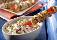 Party skewers with Lyon meat salad — Stock Photo