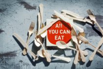 Top view of an All you can eat sign surrounded by cutlery — Stock Photo