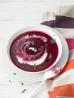Bowl of Beet Soup with a Dollop of Sour Cream Garnished with Fennel — Stock Photo