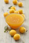 Yellow plum jam in glass bowl — Stock Photo