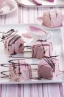 Petit fours with pink icing — Stock Photo