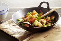 Stir-fried vegetables with tofu in wok — Stock Photo