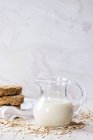 Jug of oat milk — Stock Photo