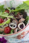 Squid salad with dandelions — Stock Photo