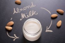 Almond milk in jar — Stock Photo