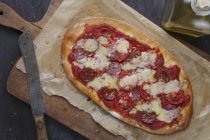 Pizza with salami Gruyere cheese — Stock Photo