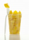 Pieces in pineapple in cup — Stock Photo