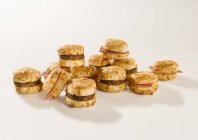 Sausage and ham on biscuits — Stock Photo