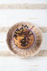 Elderberry muffin in basket — Stock Photo