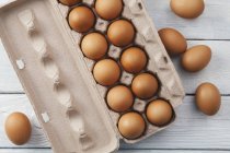 Brown eggs in egg box — Stock Photo