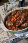 Coq au vin with  tomatoes — Stock Photo