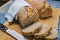 Sour dough bread on board — Stock Photo