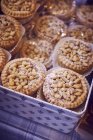 Closeup view of pine nut tartlets in box — Stock Photo