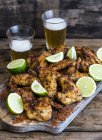 Closeup view of chicken wings with chilli and lime — Stock Photo