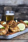 Closeup view of chicken wings with chilli and lime — Stock Photo