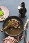Elevated view of goose leg in beer broth — Stock Photo