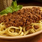 Tagliatelle pasta with minced meat sauce — Stock Photo