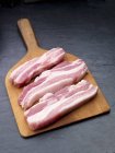 Raw slices of pork belly — Stock Photo
