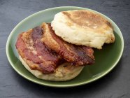 English muffin with fried pork belly — Stock Photo