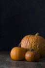 Three raw pumpkins — Stock Photo
