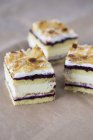 Slices of almond cream cake — Stock Photo