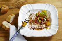 Close up of Cold roast pork with an Italian dressing — Stock Photo