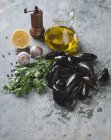 Fresh mussels with oil — Stock Photo