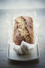 Madeira cake in baking paper — Stock Photo