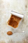 Top view of Miso paste in plastic dish and on spoon — Stock Photo