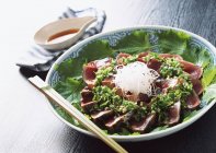 Closeup view of roasted Bonito with herbs and chopsticks — Stock Photo