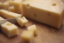Gouda being diced — Stock Photo